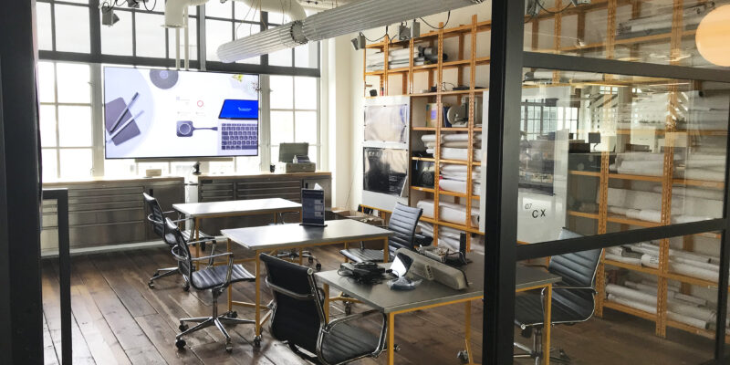 Wunderman Thompson's London office, furnished with chairs and tables. Image illustrates the results of our office fit out services.